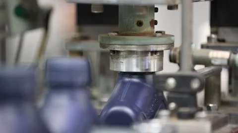 Automatic Bottles Capping of Lubricant Oil Production conveyor line. Extreme Stock Footage 302188057
