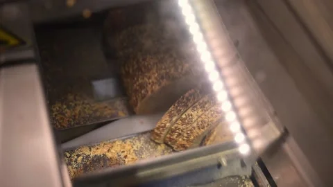 Automatic bread cutter machine in supermarket Stock Footage 202654805