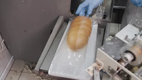 Automatic Bread Packaging Machine Sealing Fresh Bread Loaf Stock Footage 321735580