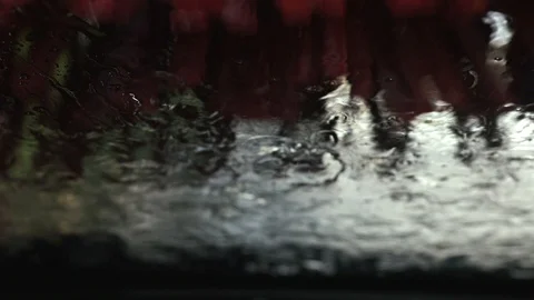 Automatic brush cleaning a car glass Stock Footage 97699655