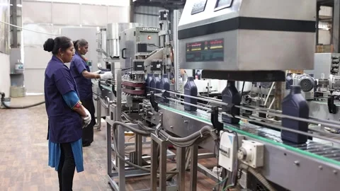 Automatic capping machine in the Lube oil manufacturing line with bath Stock Footage 302156396