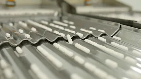 Automatic Capsule Counting and Bottling Machine in Pharmaceutical Production Stock Footage 333159574