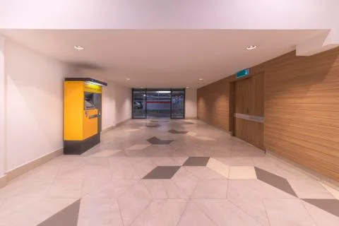 Automatic car park payment machine standing in the exit corridor leading to t Stock Photos