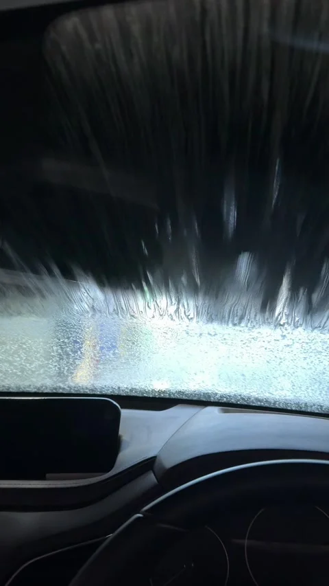 Automatic Car Wash Brushes Cleaning Windshield Viewed from Inside Vehicle 스톡 동영상 340679722