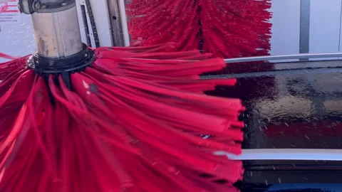 Automatic car wash cleaning vehicle with spinning brushes Stock Footage 333036272