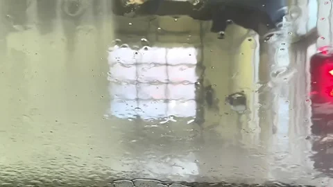 Automatic car wash from inside the car. Dashboard view inside of car in carwash. Stock Footage 262282709