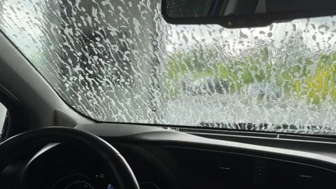 Automatic car wash point of view from inside vehicle Stock-Footage 336009221