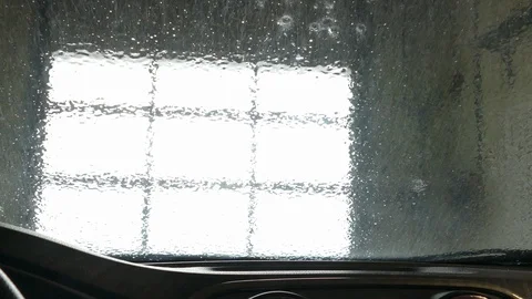 Automatic car wash seen from inside of a vehicle Stock Footage 96195383