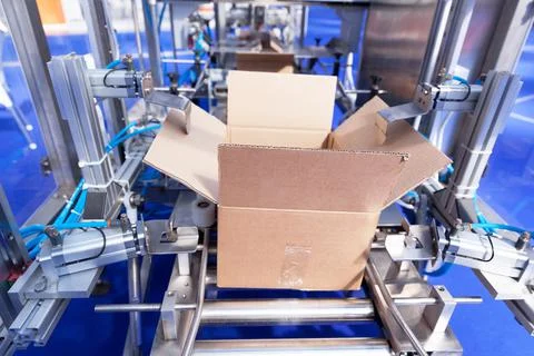 Automatic cardboard package box packaging machine Stock Photos