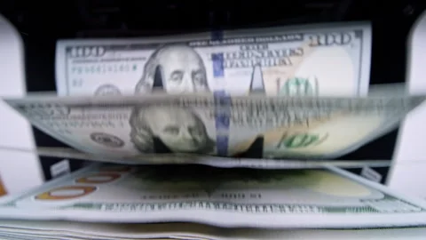 Automatic cash counting machine counting 100 dollar bills. Visual concept of Stock Footage 340025433