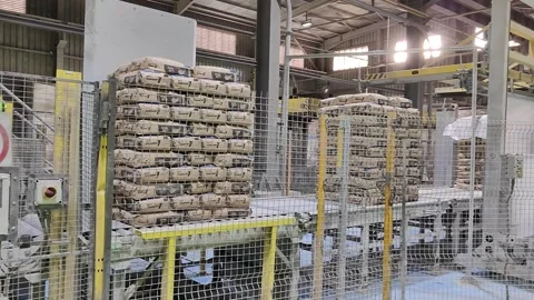 Automatic Cement Bag Palletizing and Wrapping Line 4K Stock Footage 331528998