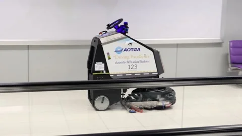 An automatic cleaning machine ride in the corridor of the international airport Stock Footage 219191461