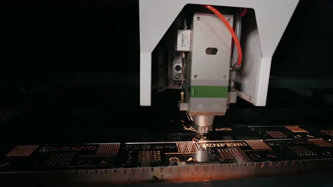 Automatic cnc laser cutting machine working with sheet metal with sparks at Stock Footage 151772798