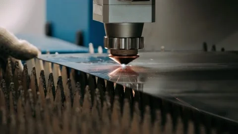 Automatic cnc laser cutting machine working with sheet metal with sparks at Stock Footage 181961580