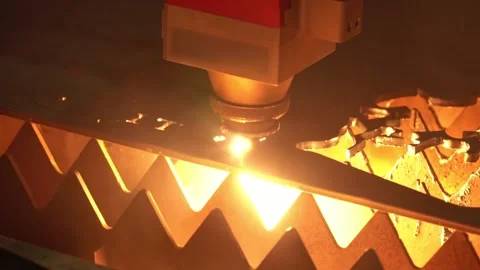 Automatic cnc laser cutting machine working with sheet metal with many sparks at Stock Footage 221440204