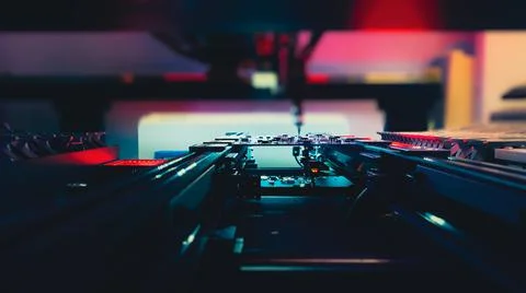 Automatic CNC machine Work: Assemble of system board elements by robotic hand. Stock Photos