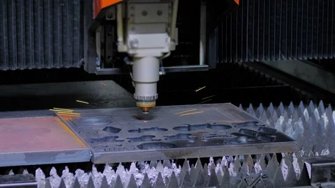 Automatic cnc plasma cutting machine is operating on sheet metal with sparks Stock Footage 344605151