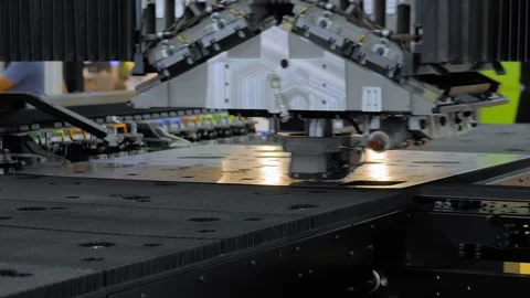 Automatic CNC punch press machine is operating on sheet metal at factory Stock Footage 344601590