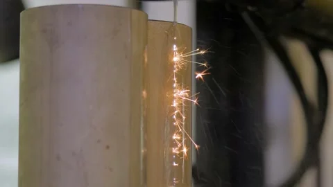 Automatic cnc wire cutting machine working with metal workpiece with sparks Stock Footage 138028102