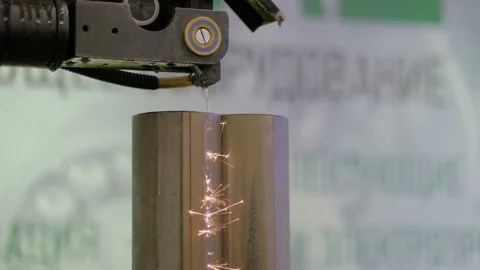 Automatic cnc wire cutting machine working with metal workpiece with sparks Stock Footage 142369239