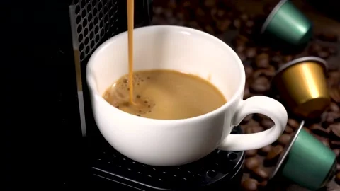 Automatic coffee machine with coffee capsules or pods pouring espresso drink. Stock Footage 225261280