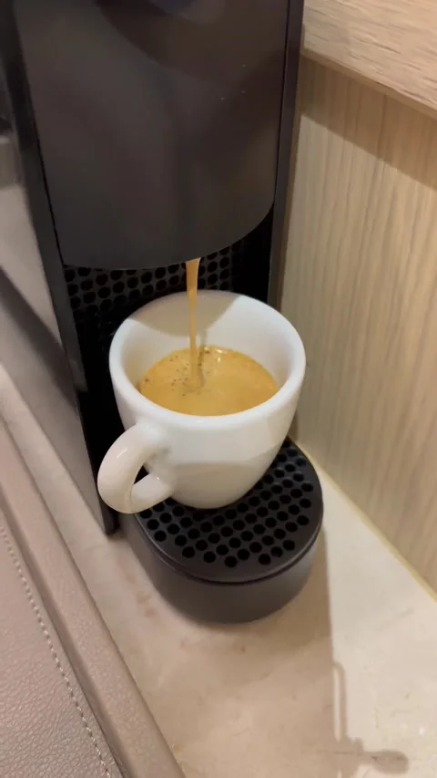 Automatic coffee machine with coffee capsules or coffee pods pouring espresso Stock Footage 231303343