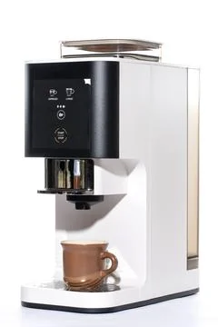 Automatic coffee machine with a cup on a white background Stock Photos