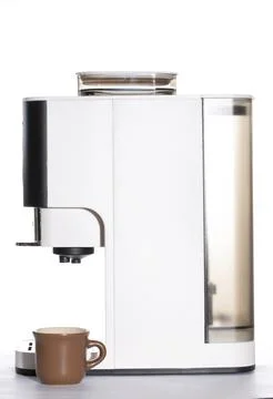 Automatic coffee machine with a cup on a white background Stock Photos