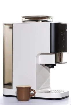 Automatic coffee machine with a cup on a white background Stock Photos