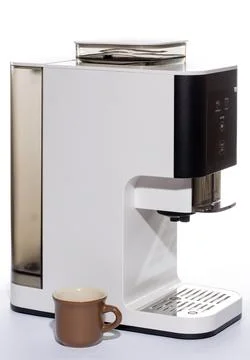 Automatic coffee machine with a cup on a white background Stock Photos