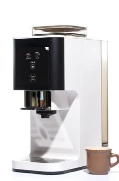 Automatic coffee machine with a cup on a white background Stock Photos
