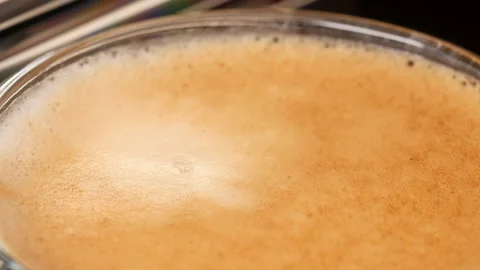 Automatic coffee machine making italian espresso coffee in glass video macro  Video stock 145603964