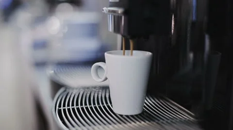 Automatic coffee machine is pouring coffee Stock Footage 57531173