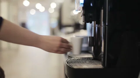 Automatic coffee machine is pouring coffee Stock Footage 57531282