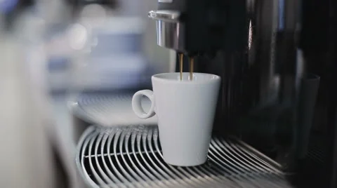 Automatic coffee machine is pouring coffee Stock Footage 57531314
