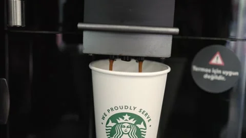 Automatic Coffee machine is pouring a coffee into the take away cup Video stock 204851167
