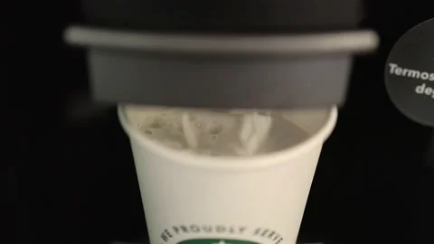 Automatic Coffee machine is pouring a coffee into the take away cup Stock Footage 204967202