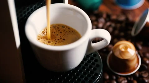 Automatic coffee machine pouring espresso drink 141320438