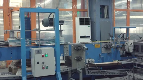 Automatic conveyor line or belt with rows of transparent crystal drink glasses  Stock Footage 121308857