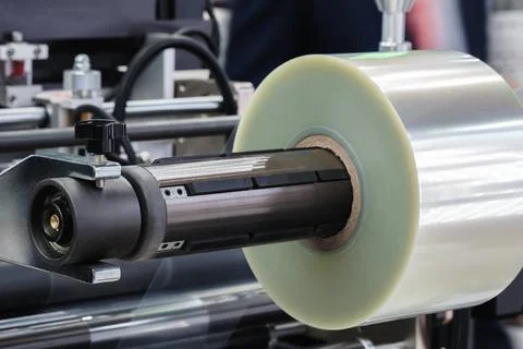 Automatic conveyor line for packaging food products into transparent, disposa 写真素材