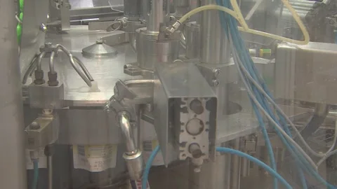 Automatic conveyor for packaging dairy products. Stock Footage 263544358