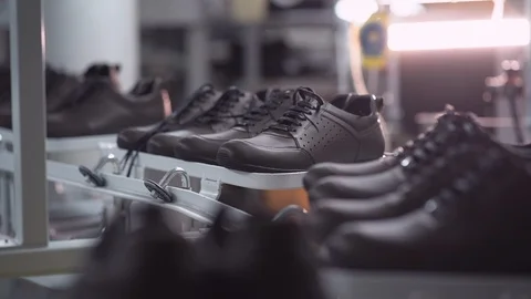 Automatic conveyor with stylish modern casual footwear Stock Footage 106537850
