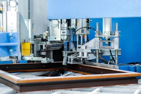 Automatic corner cleaning machine for PVC windows and doors sections with window Stock Photos