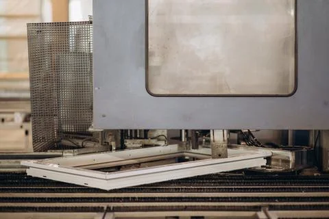 Automatic corner cleaning machine for PVC windows and doors sections with a w Stock Photos