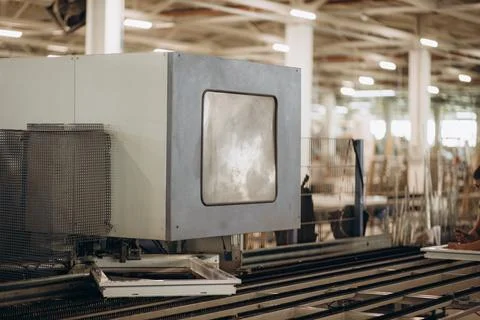 Automatic corner cleaning machine for PVC windows and doors sections with a w Stock Photos