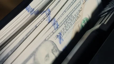 Automatic counting machine organizes US dollar banknotes for financial audit Stock Footage 340025890