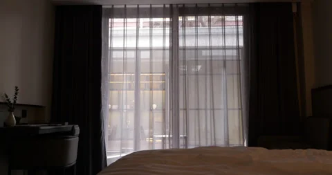 Automatic curtains opening in a modern bedroom 库存影片 322043854
