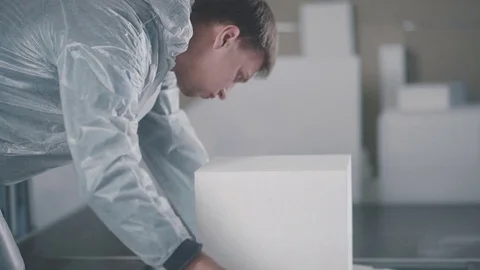 Automatic cutting of expanded polystyrene foam plastic Stock Footage 73937564