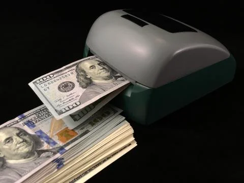 Automatic detector for checking banknotes. Dollars are checked through the de Stock Photos