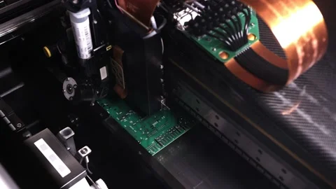 An automatic device is making a circuit board Stock Footage 163437025